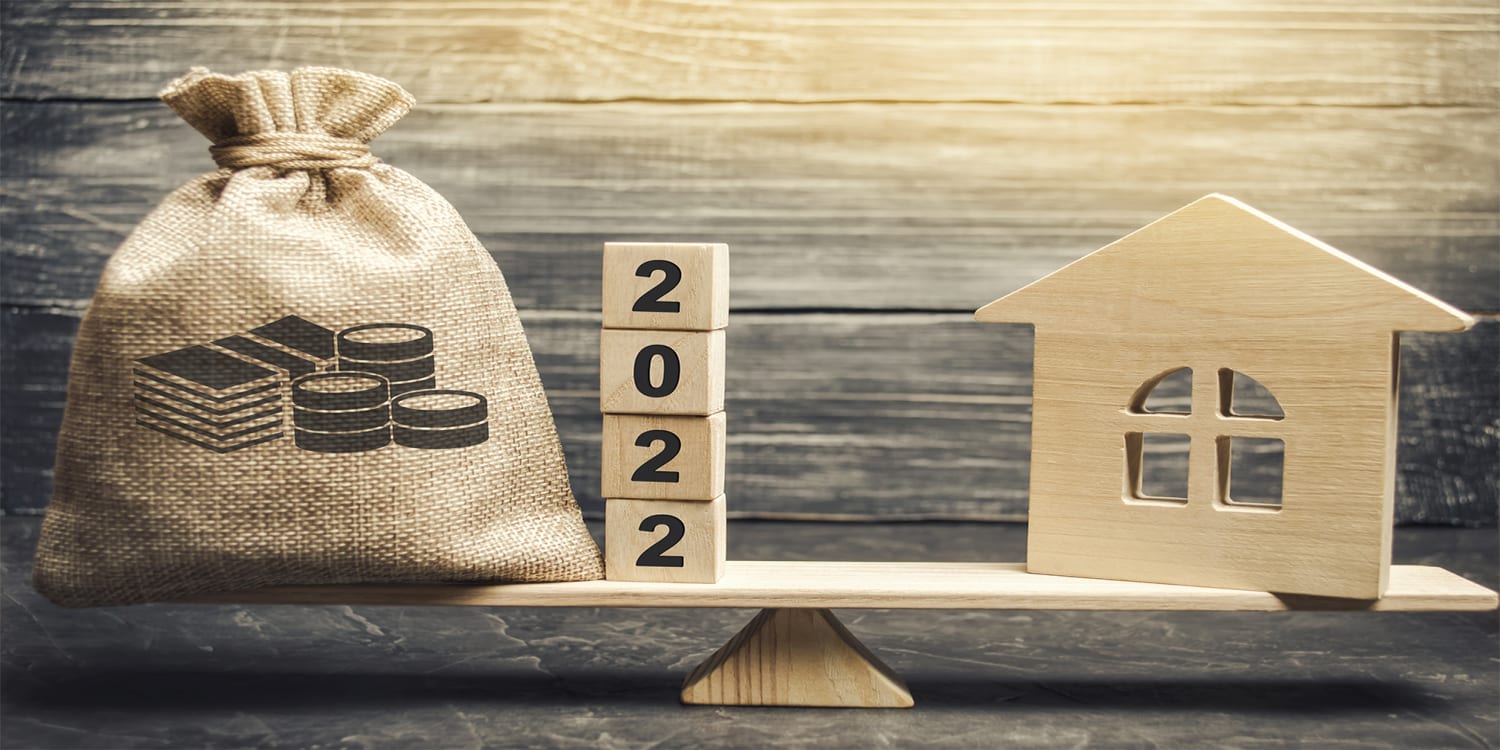 2022 real estate investment planning concept with house, cash and numbered blocks